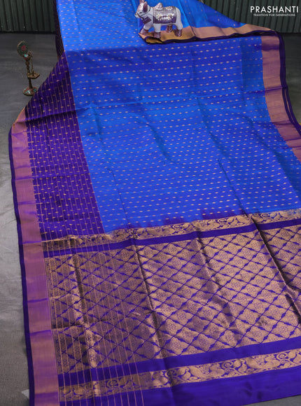 Pure uppada silk saree cs blue and blue with allover zari woven buttas and long zari woven butta border
