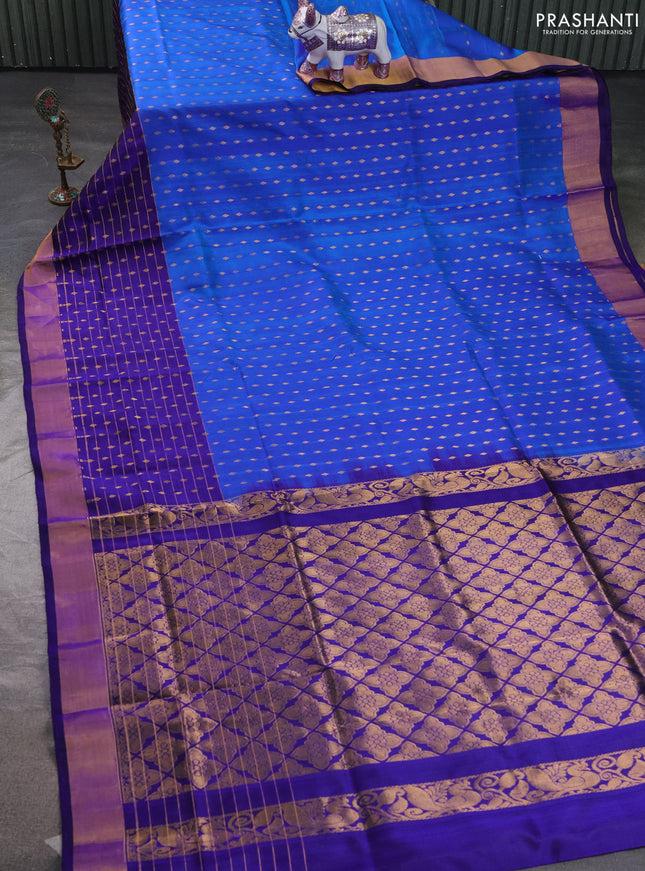 Pure uppada silk saree cs blue and blue with allover zari woven buttas and long zari woven butta border