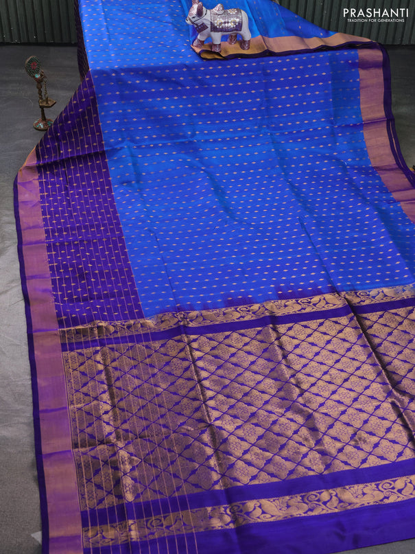 Pure uppada silk saree cs blue and blue with allover zari woven buttas and long zari woven butta border