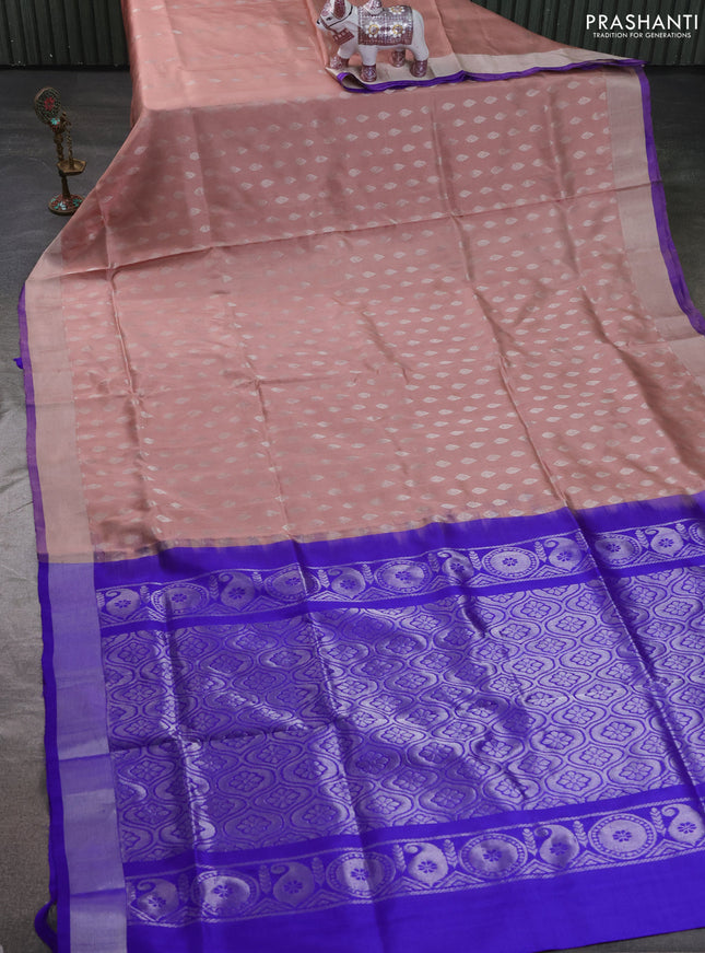 Pure uppada silk saree pastel peach and royal blue with allover zari woven buttas and zari woven border