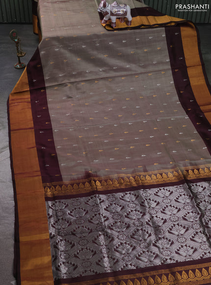 Pure uppada silk saree elachi green and coffee brown with allover silver & zari woven buttas and long zari woven butta border