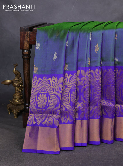 Pure uppada silk saree dual shade of bluish green and royal blue with allover silver & zari woven buttas and long zari woven border