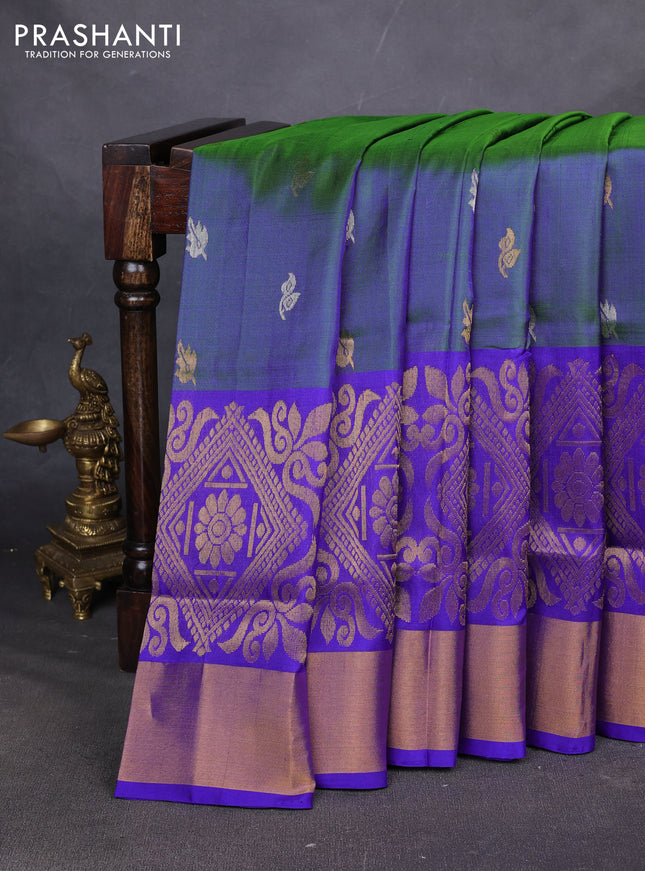 Pure uppada silk saree dual shade of bluish green and royal blue with allover silver & zari woven buttas and long zari woven border