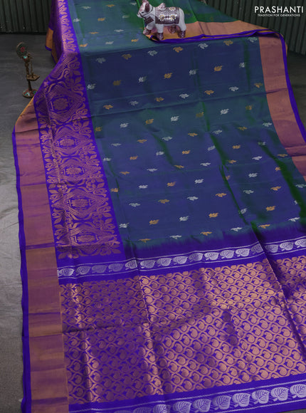 Pure uppada silk saree dual shade of bluish green and royal blue with allover silver & zari woven buttas and long zari woven border