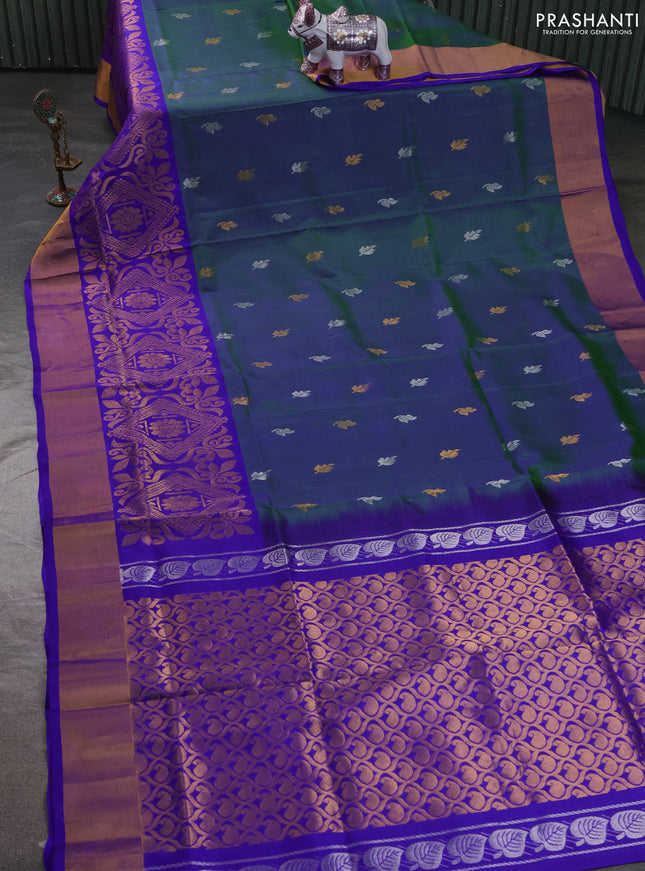 Pure uppada silk saree dual shade of bluish green and royal blue with allover silver & zari woven buttas and long zari woven border