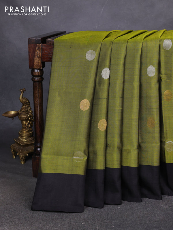 Pure uppada silk saree light green and black with allover silver & zari coin buttas and simple border