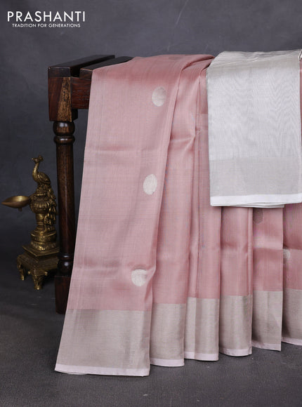 Pure uppada silk saree pastel peach and grey with allover zari coin butta and zari woven border