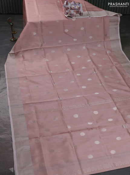 Pure uppada silk saree pastel peach and grey with allover zari coin butta and zari woven border