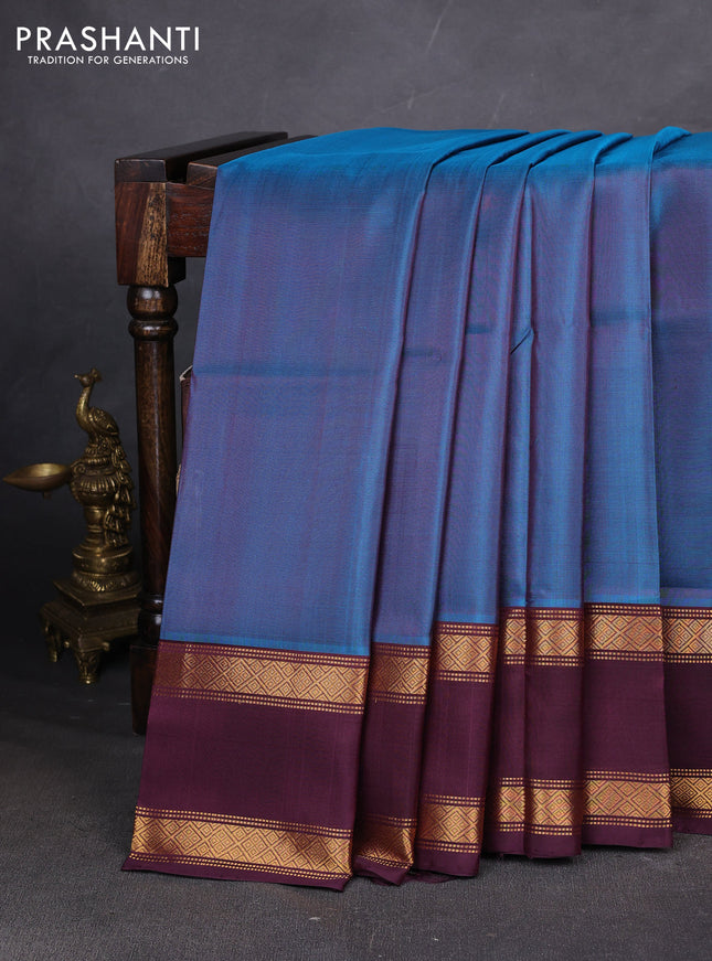 Pure uppada silk saree peacock blue and wine shade with plain body and long rettapet zari woven border