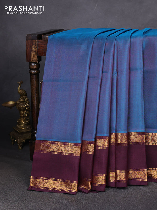 Pure uppada silk saree peacock blue and wine shade with plain body and long rettapet zari woven border