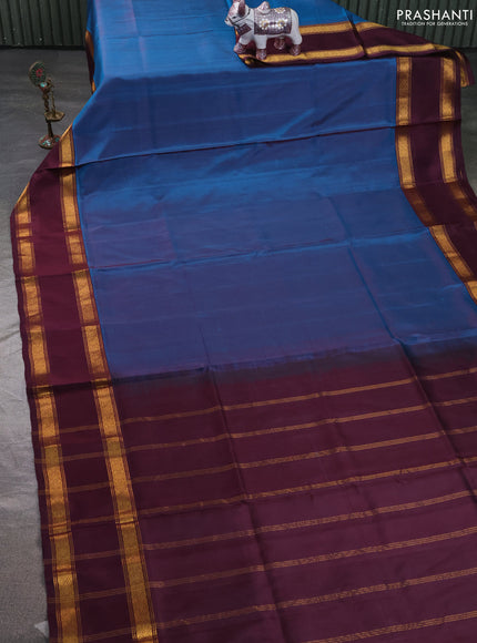 Pure uppada silk saree peacock blue and wine shade with plain body and long rettapet zari woven border