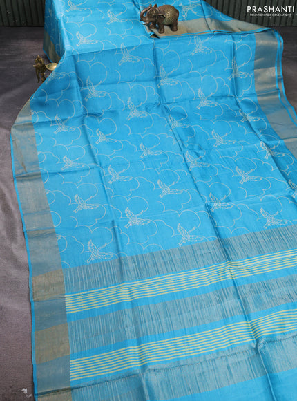 Pure tussar silk saree teal blue with allover prints and zari woven border