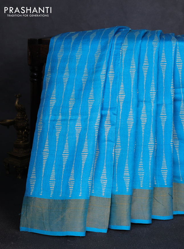 Pure tussar silk saree light blue with allover prints and zari woven border