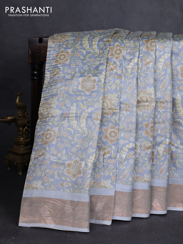 Pure tussar silk saree pastel grey with allover floral prints and zari woven border