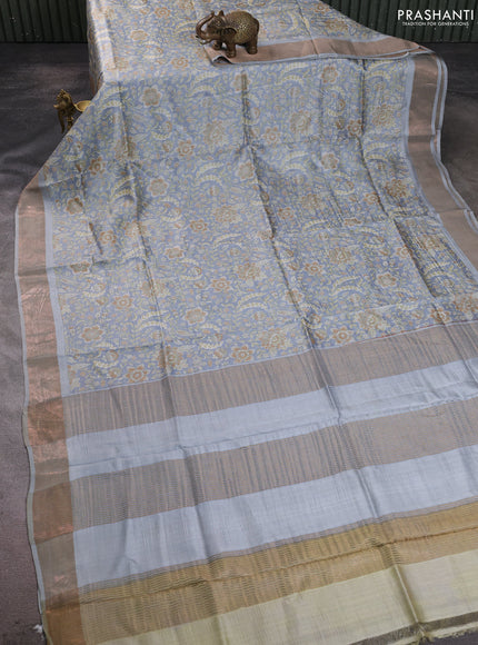 Pure tussar silk saree pastel grey with allover floral prints and zari woven border