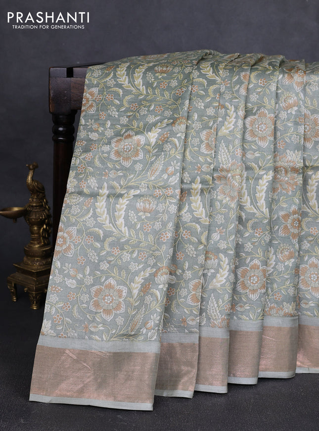 Pure tussar silk saree pastel green with allover floral prints and zari woven border