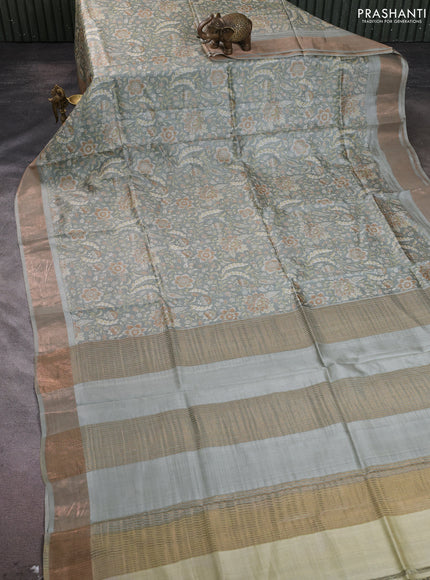 Pure tussar silk saree pastel green with allover floral prints and zari woven border