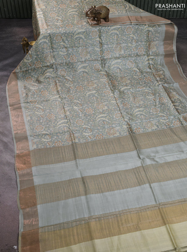 Pure tussar silk saree pastel green with allover floral prints and zari woven border