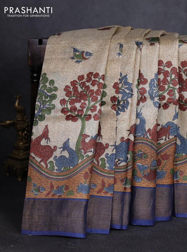 Pure tussar silk saree cream dark mustard and blue with allover kalamkari prints and zari woven border
