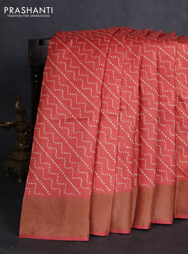 Pure tussar silk saree rust shade with allover prints and zari woven border