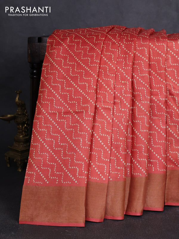 Pure tussar silk saree rust shade with allover prints and zari woven border
