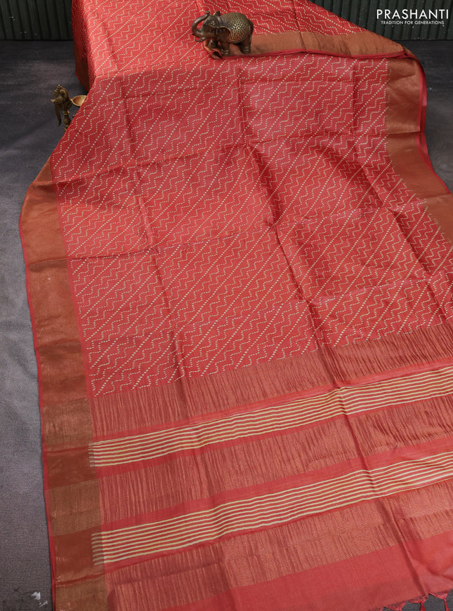 Pure tussar silk saree rust shade with allover prints and zari woven border