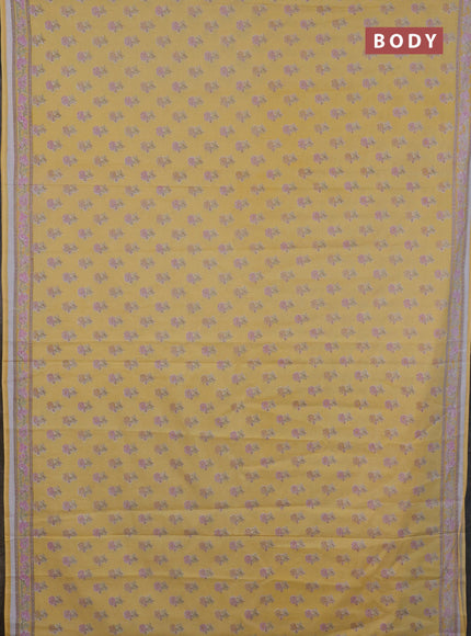 Mul cotton saree yellow with allover butta prints and printed border