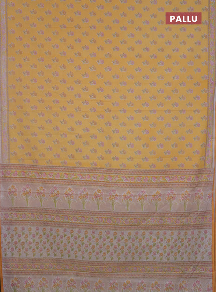 Mul cotton saree off white and mango yellow with allover butta prints and printed border