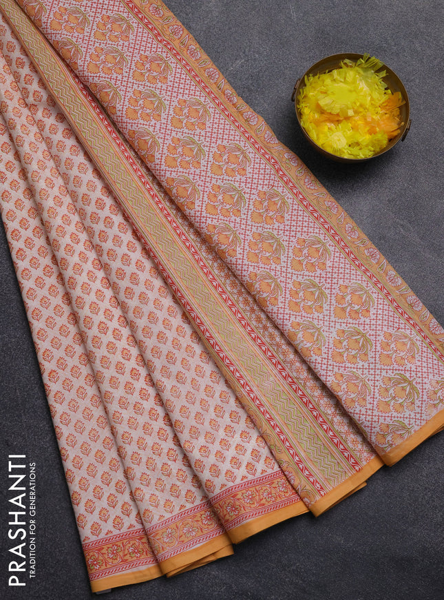 Mul cotton saree cream and orange with allover butta prints and printed border