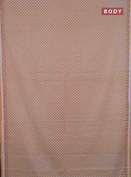 Mul cotton saree cream and orange with allover butta prints and printed border