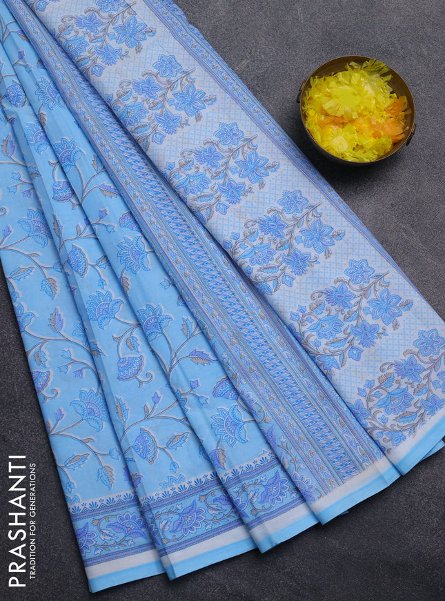 Mul cotton saree light blue with allover floral prints and printed border