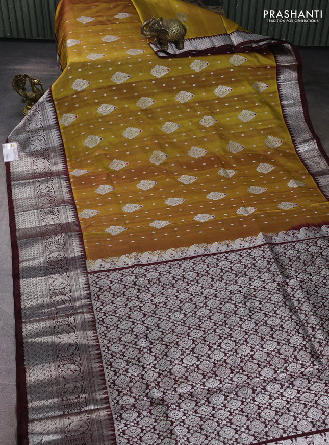 Venkatagiri silk saree mustard green and coffee brown with allover silver zari woven buttas and long silver zari woven border