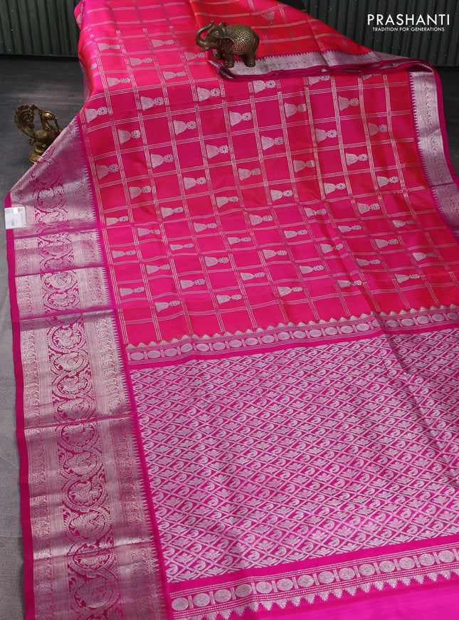 Venkatagiri silk saree dual shade of pinkish orange and pink with allover silver zari checks & buttas and long silver zari woven border