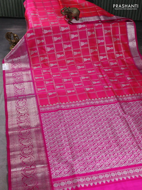Venkatagiri silk saree dual shade of pinkish orange and pink with allover silver zari checks & buttas and long silver zari woven border
