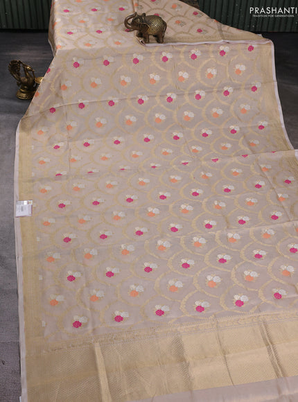 Banarasi tissue uppada silk saree cream with allover thread & zari floral weaves and zari woven border