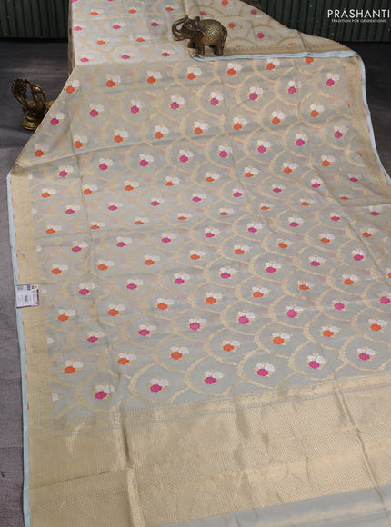 Banarasi tissue uppada silk saree cream and pastel blue with allover zari weaves and zari woven border