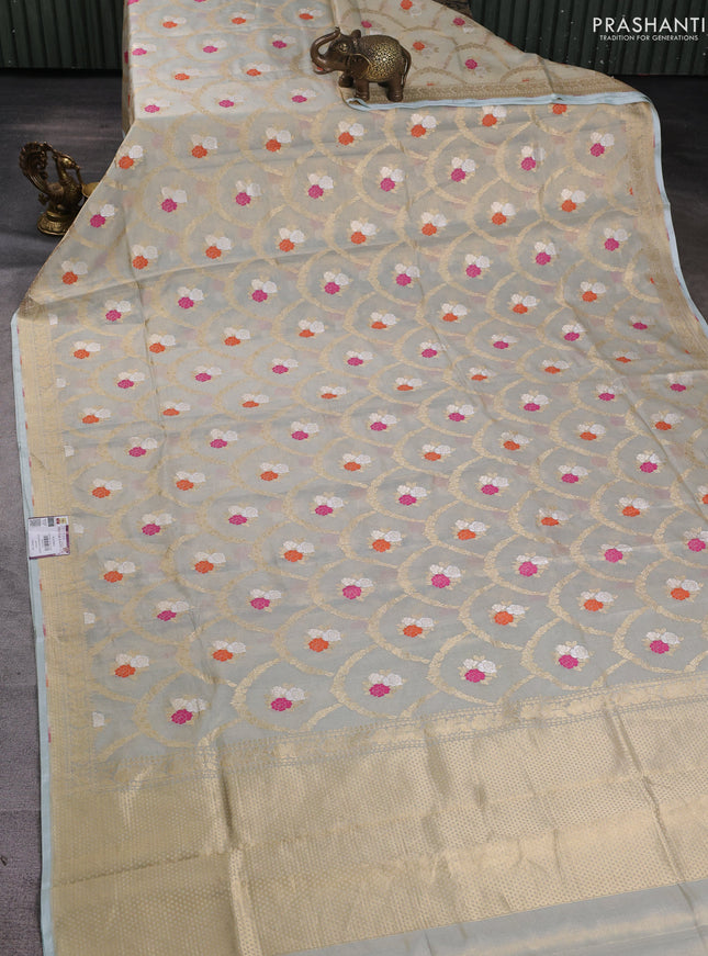 Banarasi tissue uppada silk saree cream and pastel blue with allover zari weaves and zari woven border