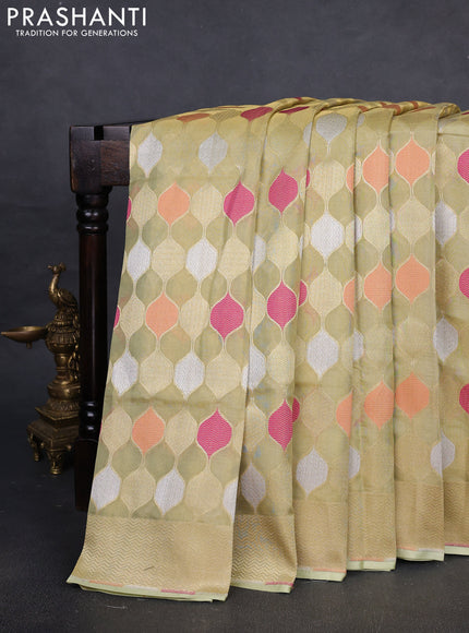 Banarasi tissue uppada silk saree pista green with allover thread & zari geometric weaves and zari woven border