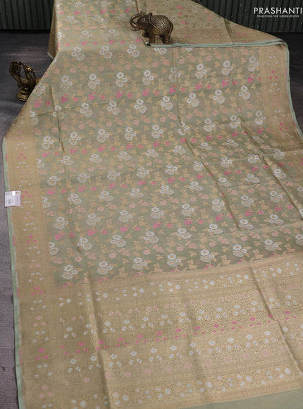 Banarasi tissue uppada silk saree pista green with allover thread & zari floral weaves and zari woven border