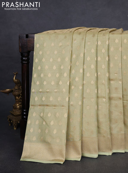 Banarasi tissue uppada silk saree pista green with allover zari woven butta weaves and zari woven border