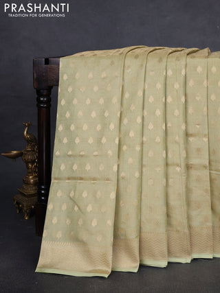 Banarasi tissue uppada silk saree pista green with allover zari woven butta weaves and zari woven border