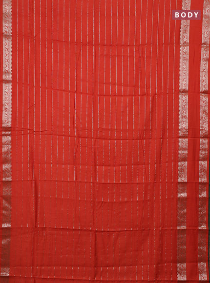 Semi chanderi saree rust shade and green with allover zari weaves and rettapet zari woven border