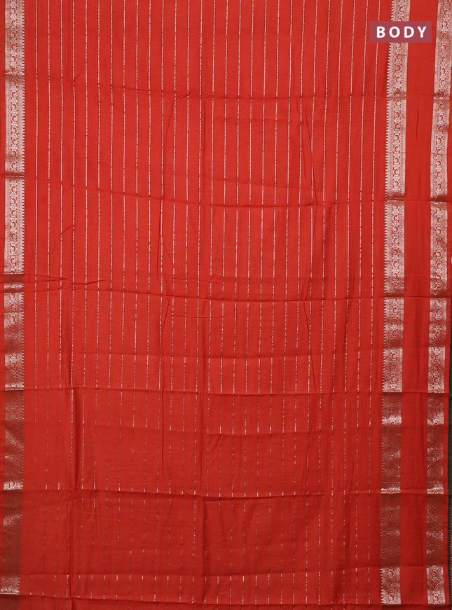 Semi chanderi saree rust shade and green with allover zari weaves and rettapet zari woven border