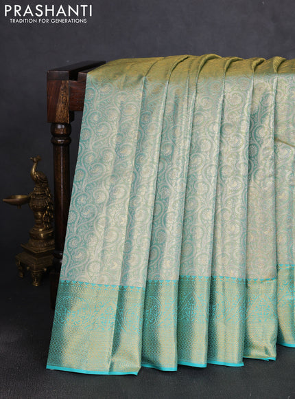 Pure kanchipuram tissue silk saree dual shade of teal and teal blue with allover zari woven brocade weaves and rich zari woven border