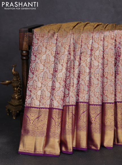 Pure kanchipuram tissue silk saree dual shade of gold and purple with allover zari woven brocade weaves and long rich zari woven border