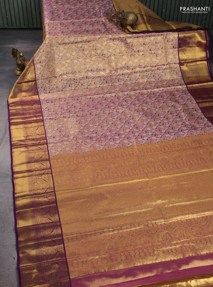 Pure kanchipuram tissue silk saree dual shade of gold and purple with allover zari woven brocade weaves and long rich zari woven border
