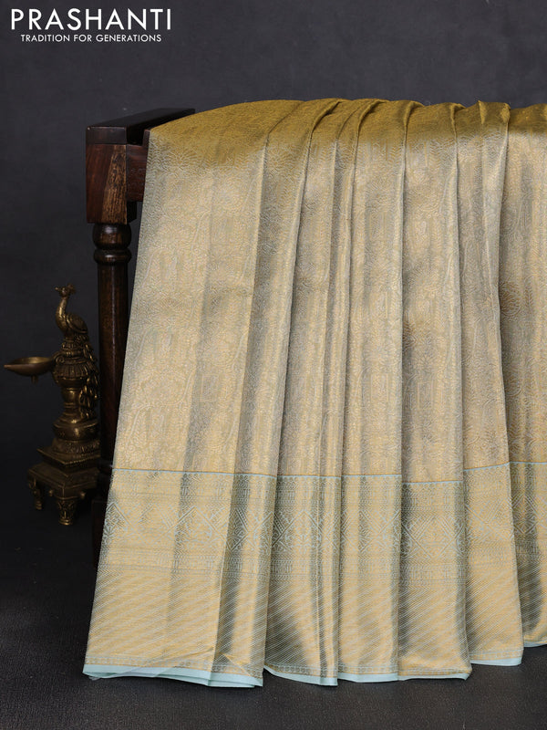 Pure kanchipuram tissue silk saree gold and mild teal blue with allover zari woven brocade weaves and rich zari woven border
