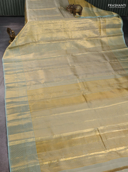 Pure kanchipuram tissue silk saree gold and mild teal blue with allover zari woven brocade weaves and rich zari woven border