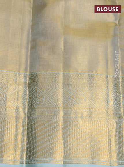 Pure kanchipuram tissue silk saree gold and mild teal blue with allover zari woven brocade weaves and rich zari woven border