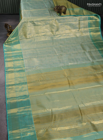 Pure kanchipuram tissue silk saree golden teal and teal blue with allover zari woven brocade weaves and rich zari woven border